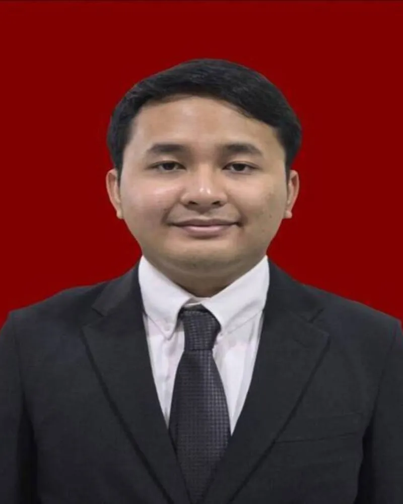 Portrait of Azzel Reyhanth Aristo in a dark suit and tie